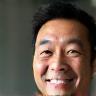 Photo of Thomas Nguyen, happy with his table restoration